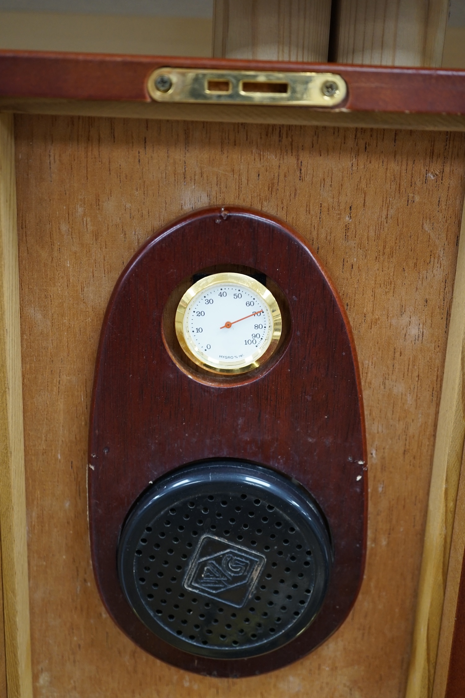 A writing slope, humidor and contents including a silver mounted cigar case, an Evans Electroselenium Ltd. light meter and a Weston Voltmeter. Condition - fair.